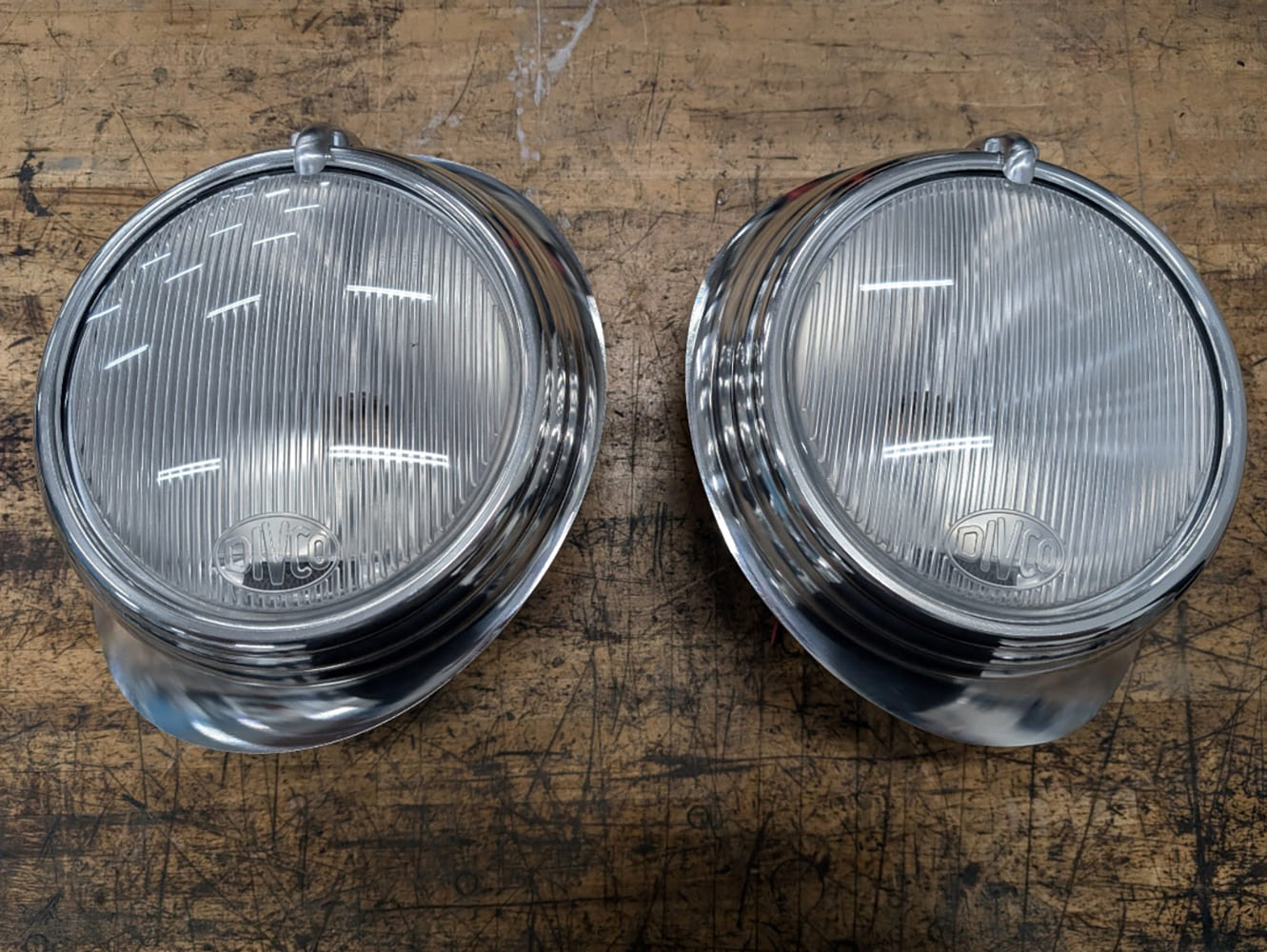 21 Divco full custom headlight assemblies with fluted lenses and tab top mounts in polished bezels