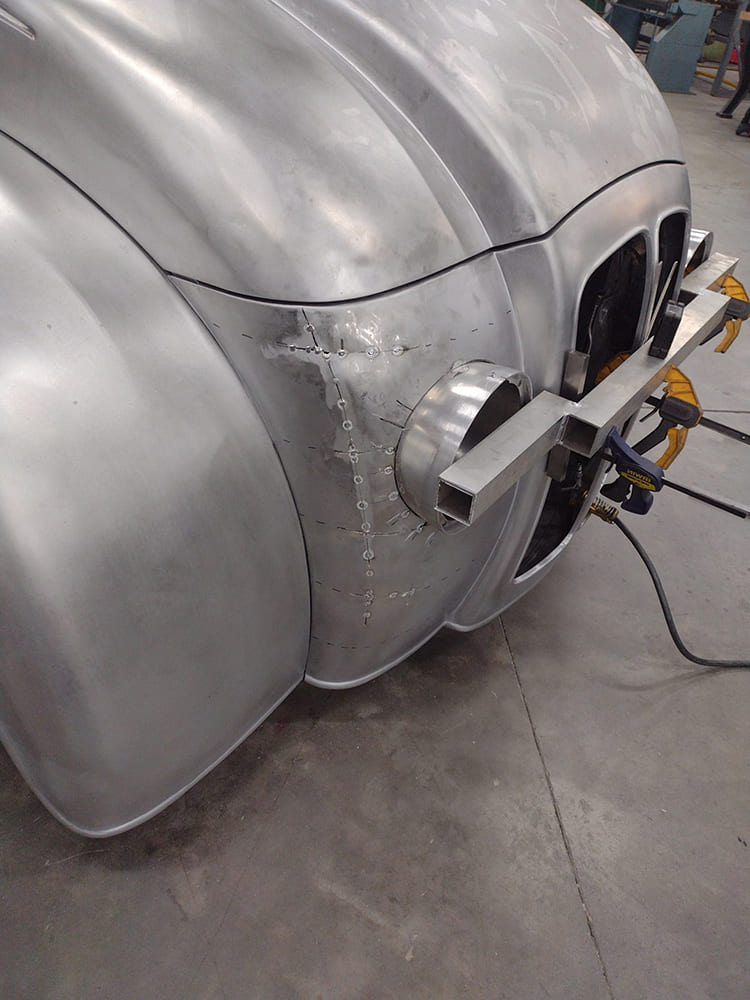 23 Divco headlight bucket alignment mockup tacked to fender with trim support and outer skin clamps