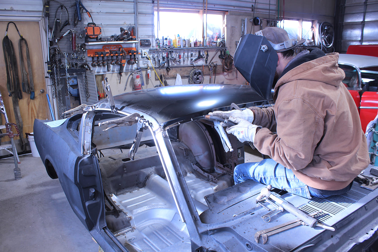 25 Replacement roof panel tack welded in place with panel clamps for accurate fitment