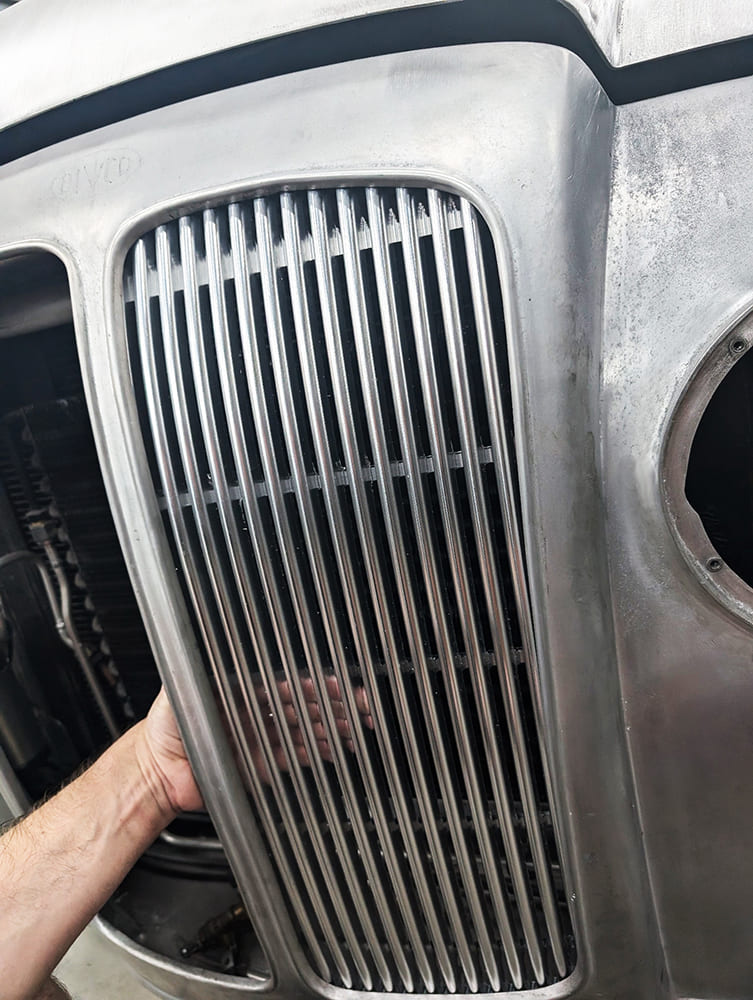 27 Divco grille bars test fit into nose shell with surrounding edge contour and open vent layout