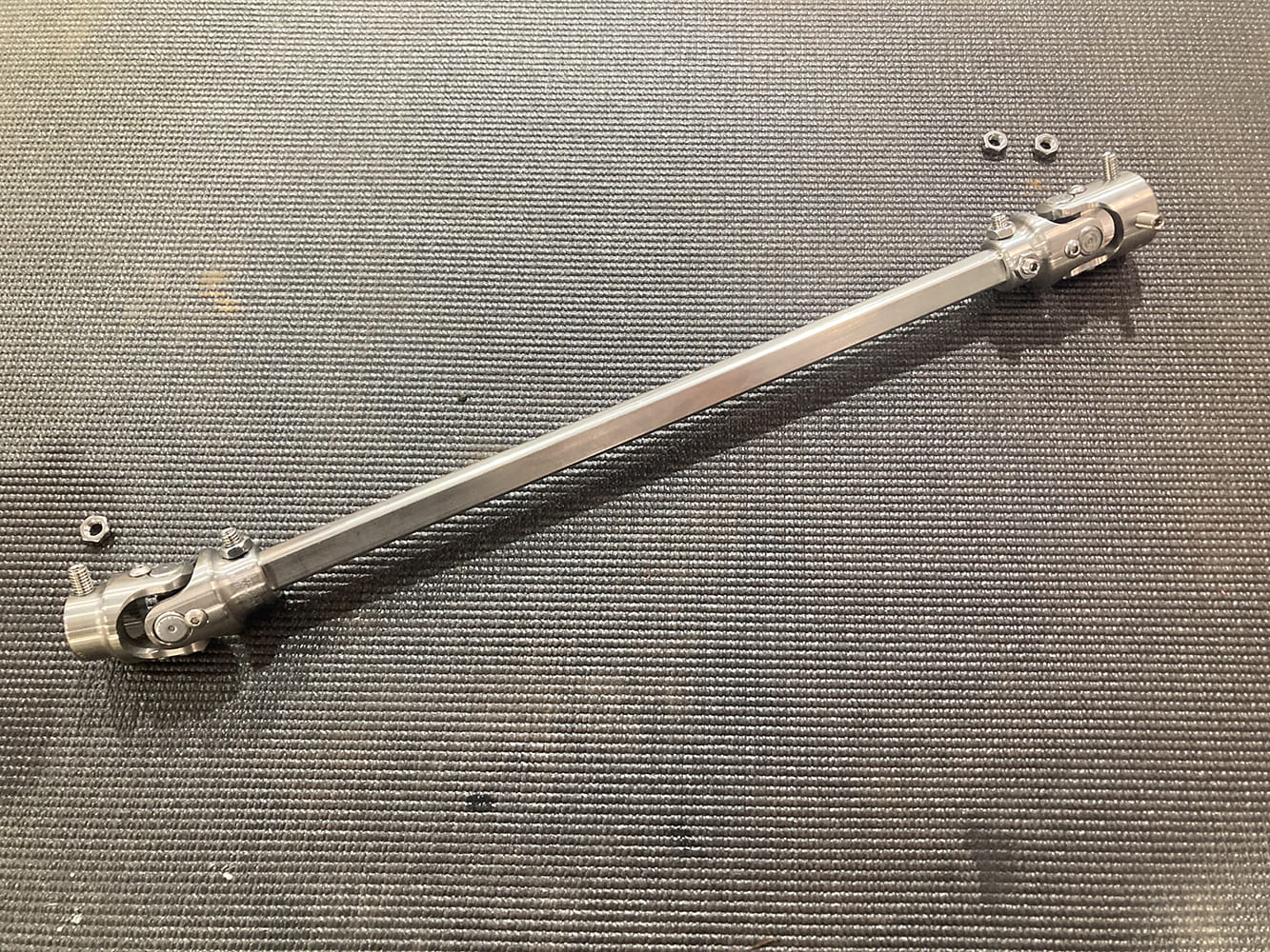 28 1964 Pontiac GTO fully assembled intermediate shaft with double U joints and hardware laid out