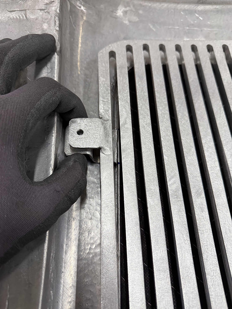 28 Divco vent grille panel bracket detail showing tab alignment and bolt on mounting solution