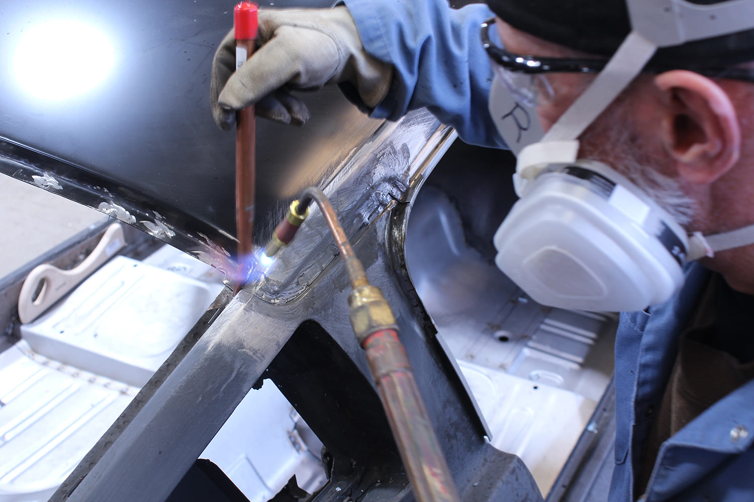 28 Plug welds applied to factory roof flange holes using MIG welder for strong bond