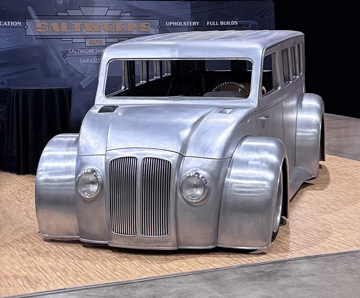 30 Divco custom wagon bare metal full build with widebody fenders dual grille insert and flush glass treatment at Saltworks booth