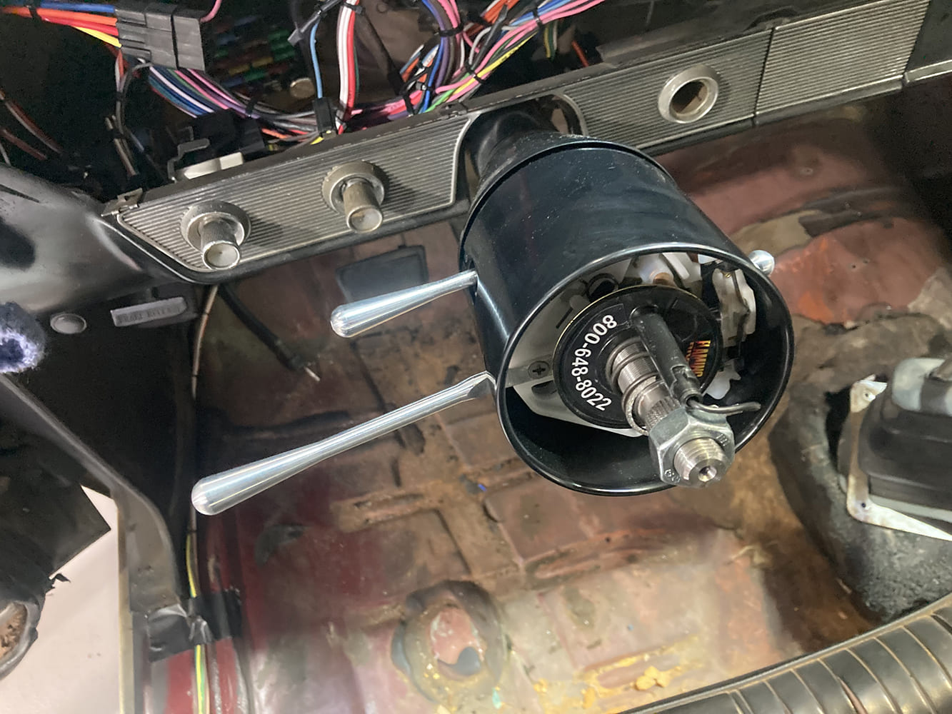 32 1964 Pontiac GTO tilt column prepped for steering wheel install with exposed shaft and wiring