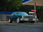 001 1977 Chevy Malibu SS front view chrome bumper gas station