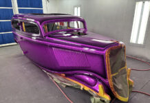 01 1930s classic car body with metallic purple flake paint in professional spray booth