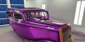 01 1930s classic car body with metallic purple flake paint in professional spray booth