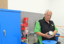 01 POR 15 top coat prep station with technician inspecting can before application