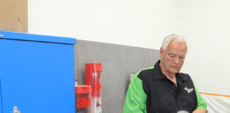 01 POR 15 top coat prep station with technician inspecting can before application