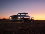 02 Lowered 1972 Chevy C10 black red headlights on custom wheels desert sunset
