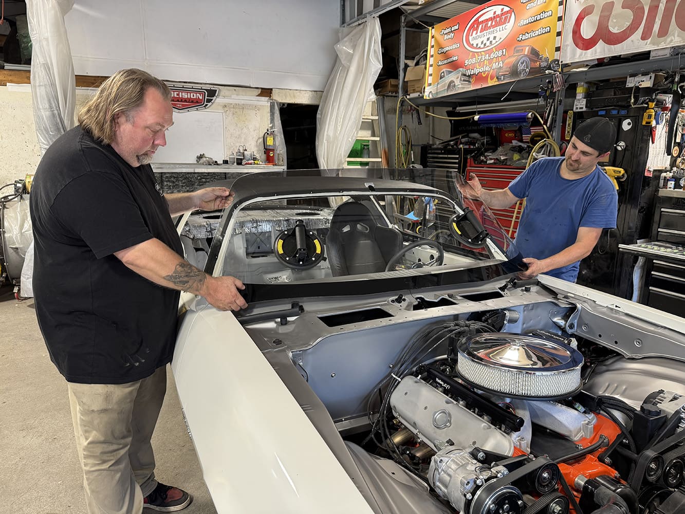 021 1971 Camaro front windshield install two man glass placement suction cups