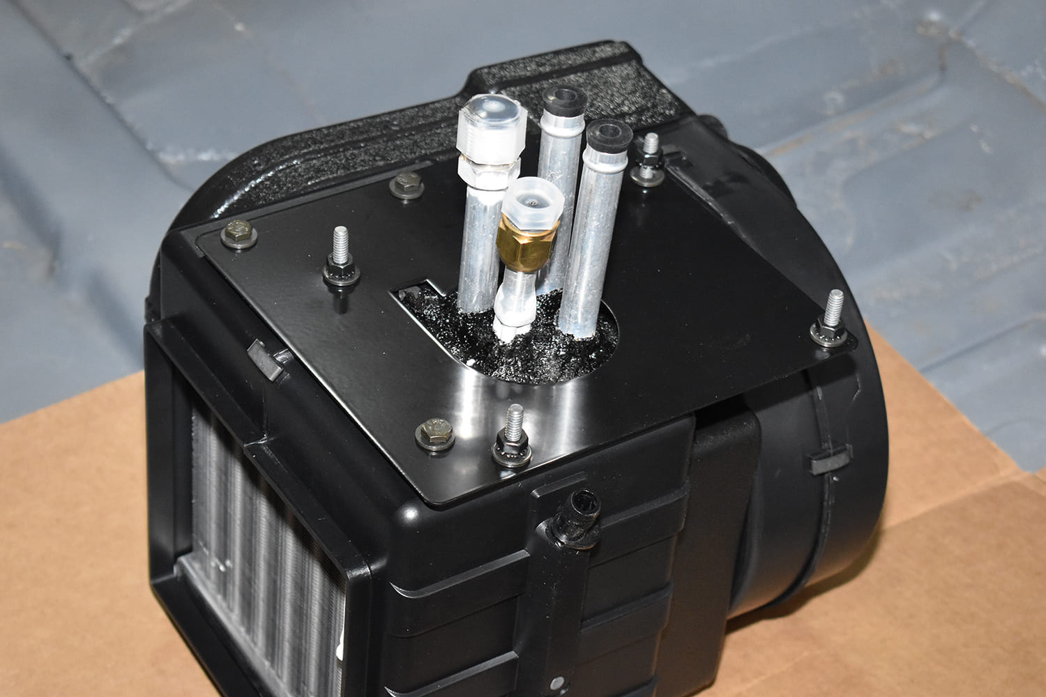 04 1951 Chevy AC evaporator input output port close up fittings heater core plumbing