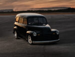 04 1952 Chevy Suburban black front three quarter runway sunset reflections