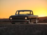04 Black red 1972 Chevy C10 headlights on orange sunset sky desert background
