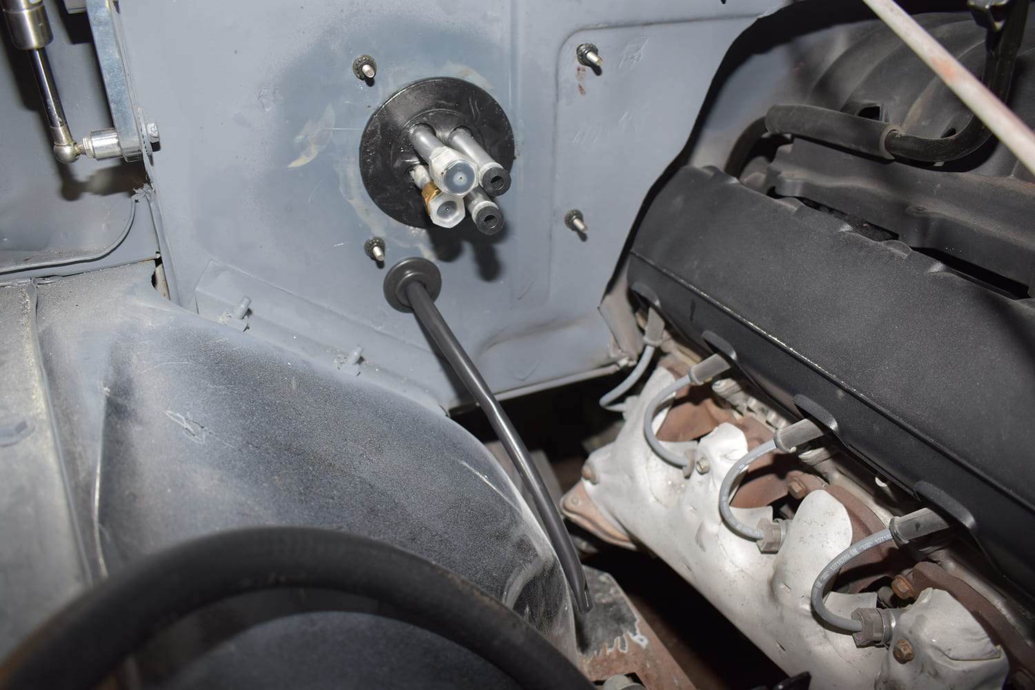 06 1951 Chevy AC firewall port fittings installed LS engine bay view