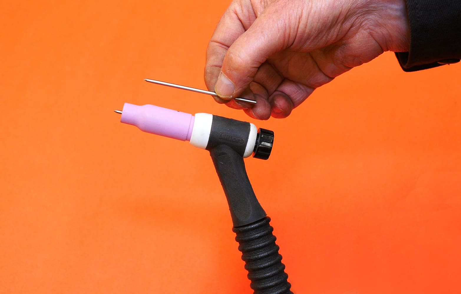 06 TIG torch with pink cup freshly sharpened tungsten tip ready for arc start