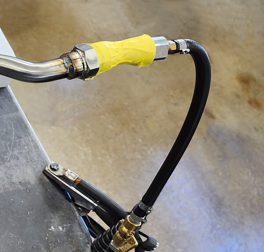 06 Welded AN fitting yellow masking tape brass T fitting flexible black hose