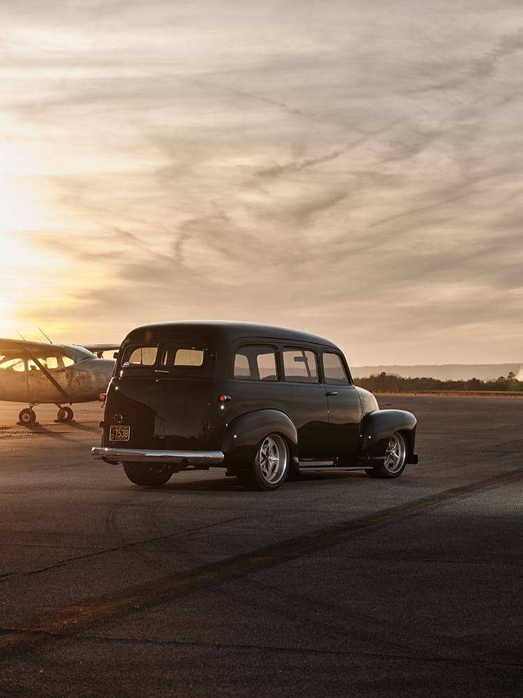 07 1952 Chevy Suburban rear three quarter gloss black CA plate modern wheels