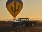 07 1972 Chevrolet C10 black truck hot air balloon background desert landscape