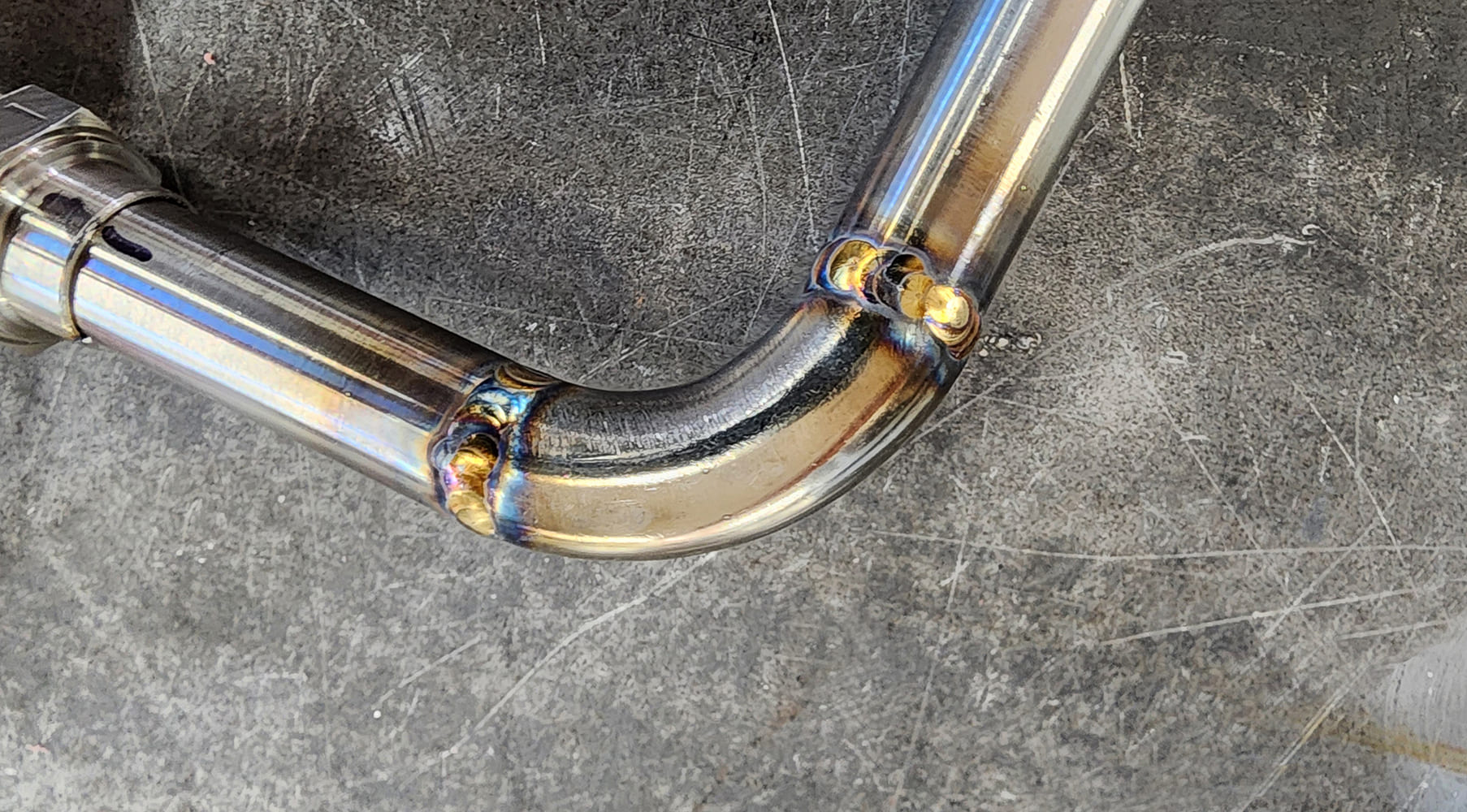 07 Welded joint macro three weld beads heat discoloration radius bend