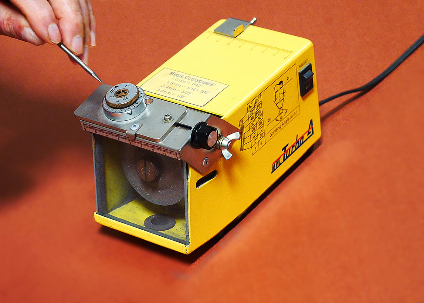 10 Turbo A bench tungsten grinder electrode insertion angle charts and metric conversion visible