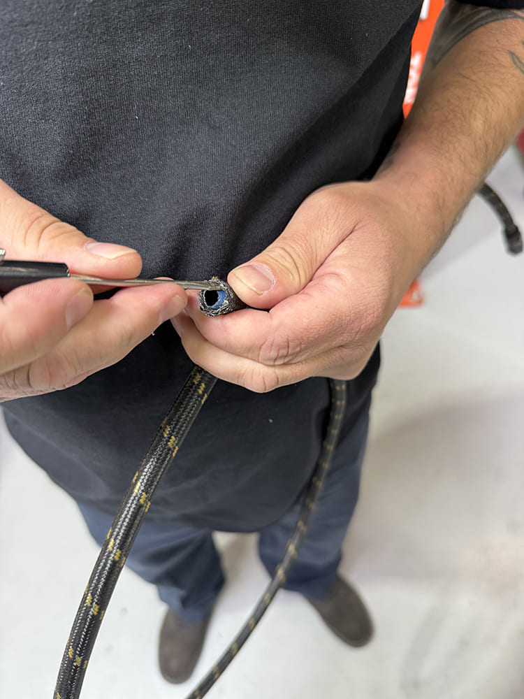 13 Deburring braided hose inner liner with pick tool for smooth fitting install