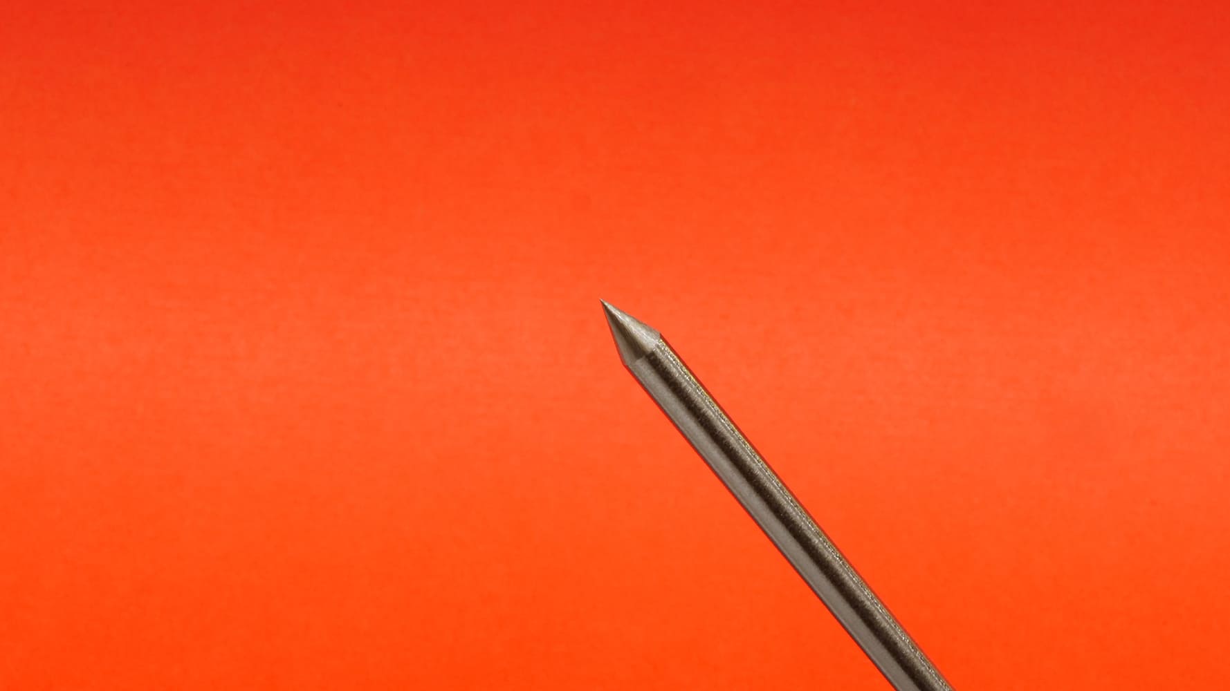 13 TIG tungsten electrode precise taper angled view orange background