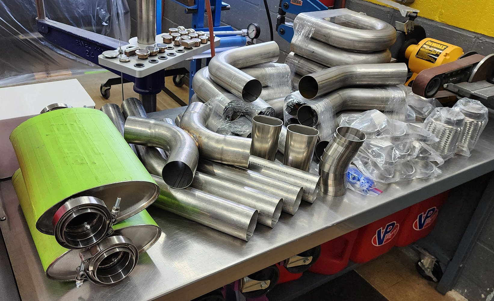 13 Workshop table mufflers green masking tape stainless bends VP Racing Fuel containers