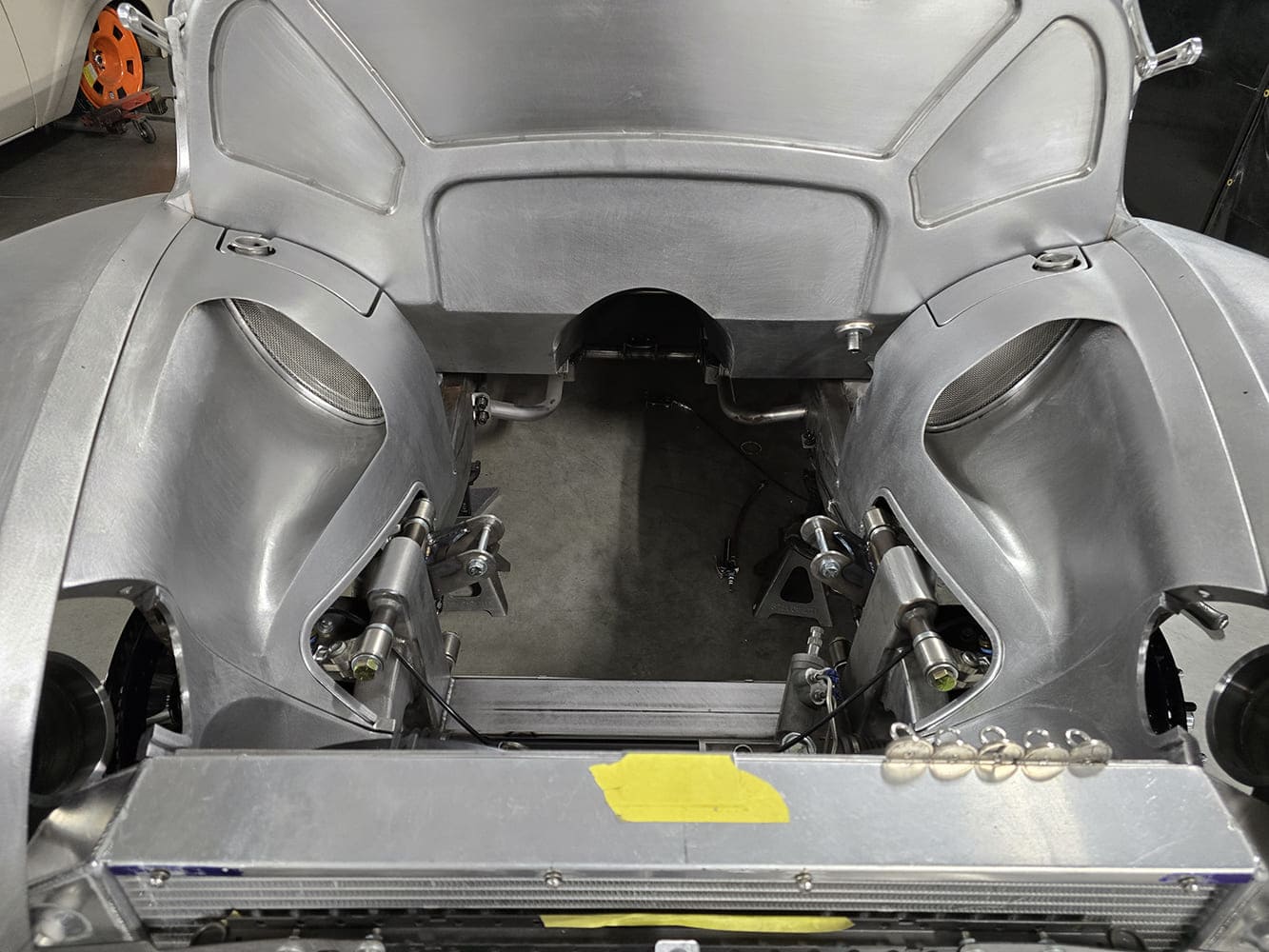 15 1951 Chevy raw engine bay symmetrical inner fenders billet fill caps installed