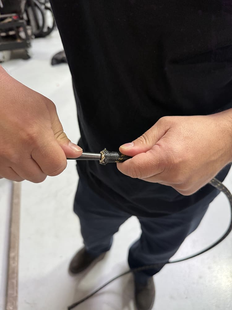 17 Cleaning debris and adjusting braid with pick for tight AN seal