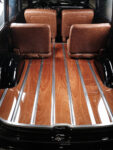 18 1952 Chevy Suburban cargo area wood plank floor polished metal strips seatbacks glossy black wheel well