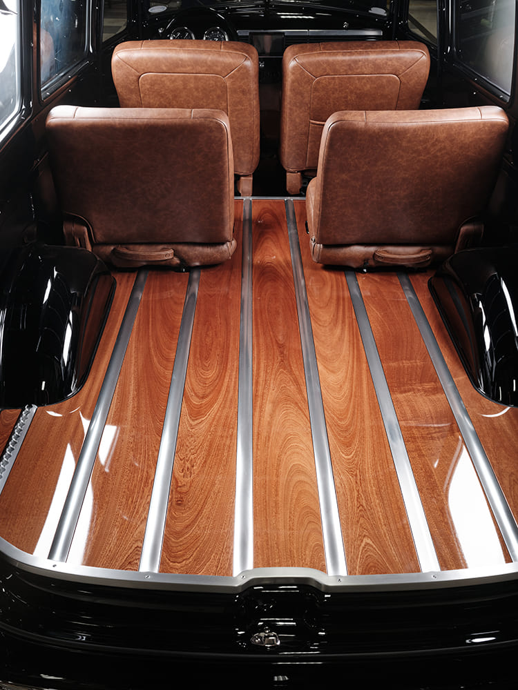 18 1952 Chevy Suburban cargo area wood plank floor polished metal strips seatbacks glossy black wheel well
