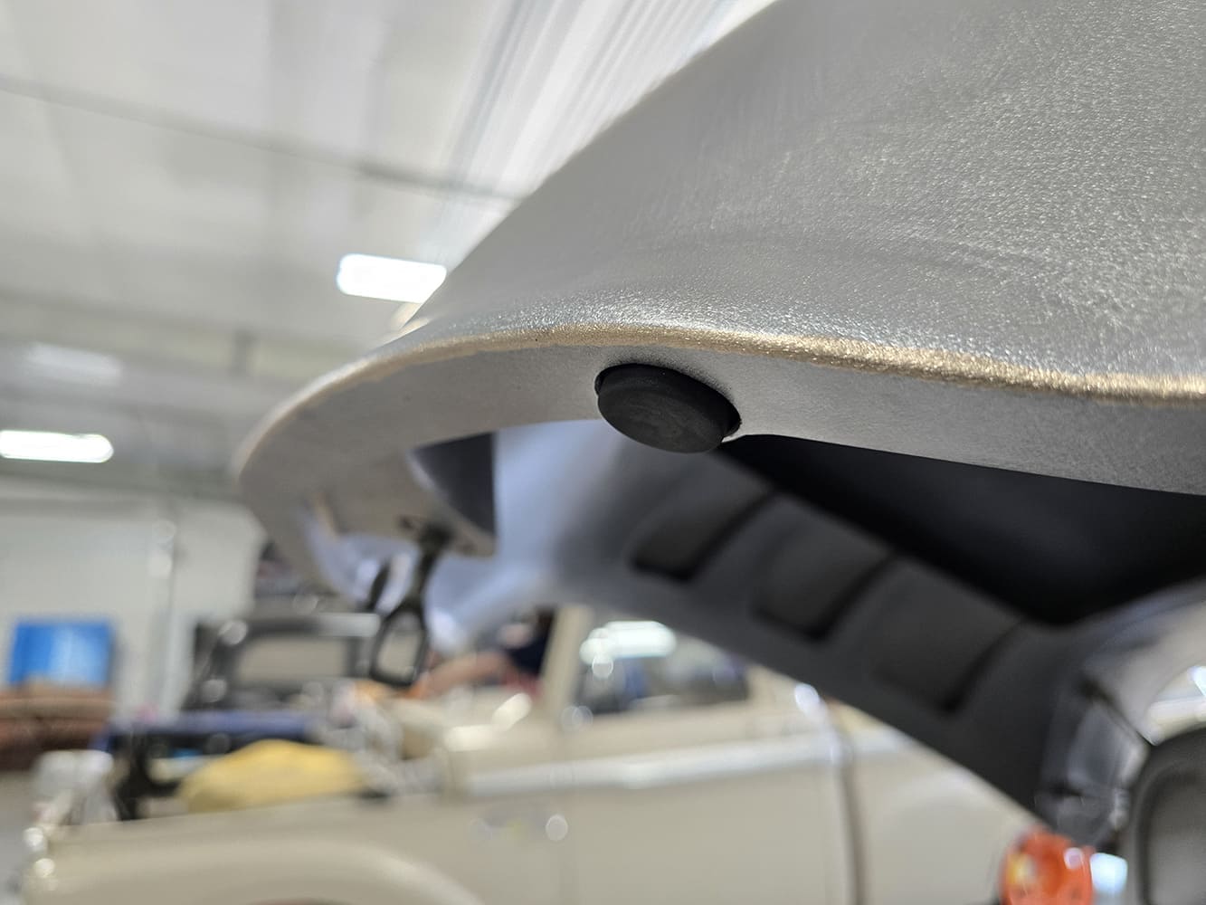 21 1951 Chevy hood edge bumper stop detail custom bracing raw metal close up