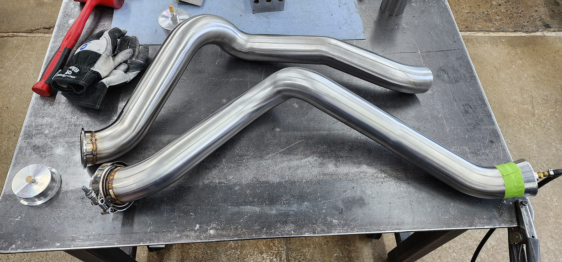 21 Z bend exhaust pipes V band clamp red dead blow hammer welding gloves green tape