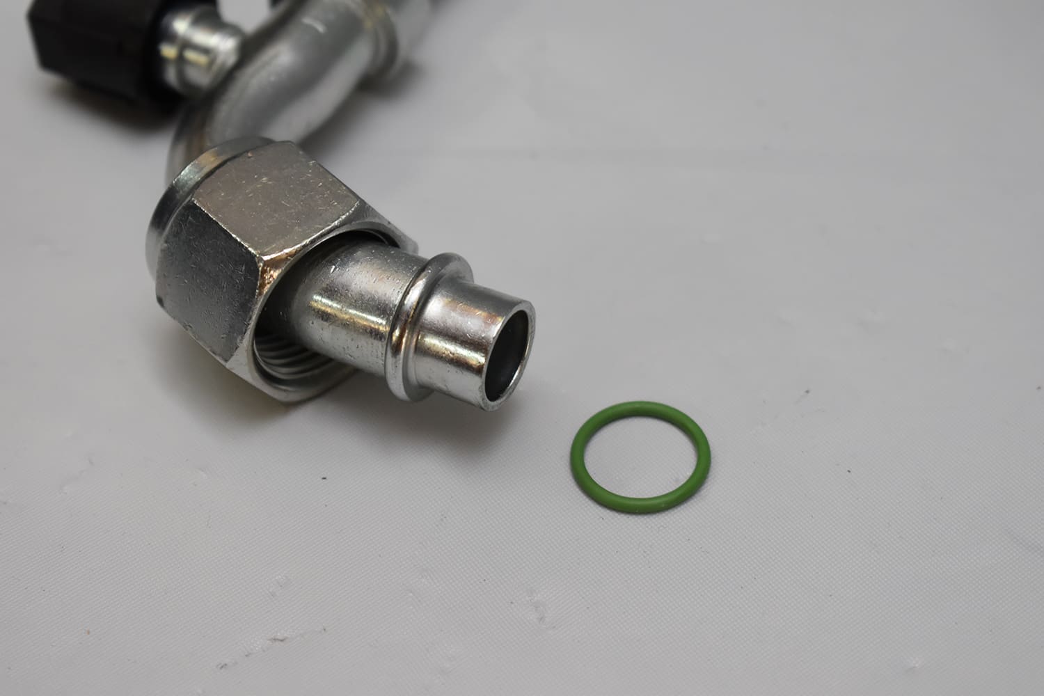 24 1951 Chevy AC line green O ring seal close up aluminum fitting refrigerant connection prep