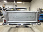 00 Chevy Task Force tailgate bare metal installed on truck chrome bumper taped red taillights shop with Miller Dynasty 350