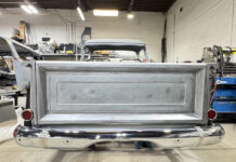 00 Chevy Task Force tailgate bare metal installed on truck chrome bumper taped red taillights shop with Miller Dynasty 350