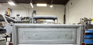 00 Chevy Task Force tailgate bare metal installed on truck chrome bumper taped red taillights shop with Miller Dynasty 350