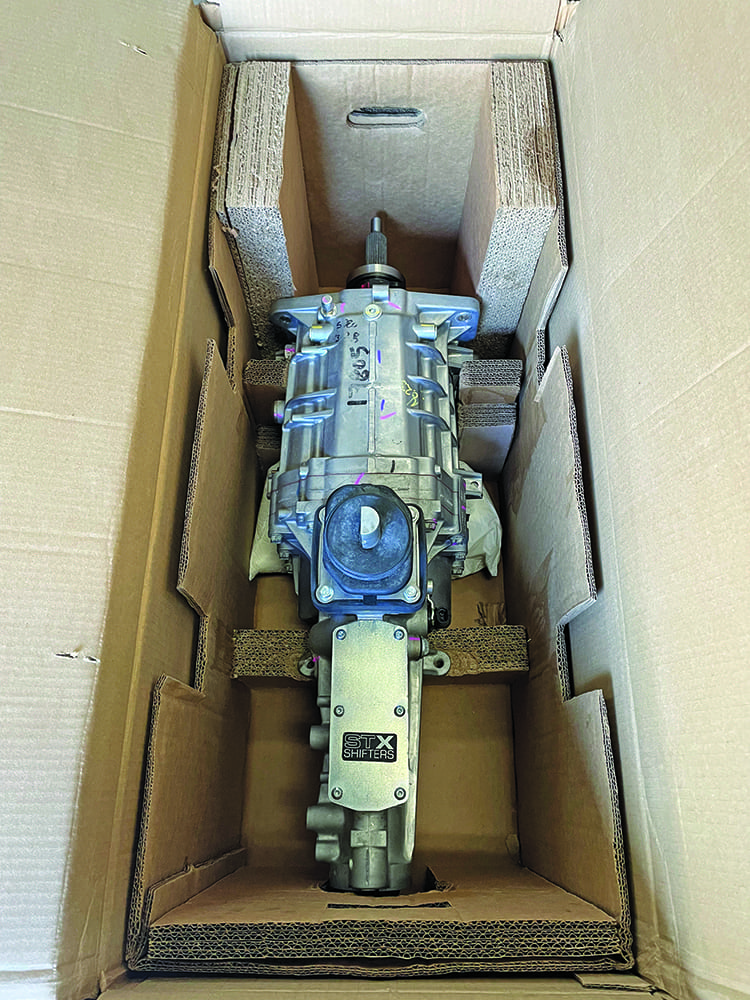 02 Tremec manual transmission in shipping box silver bellhousing cardboard packaging protection