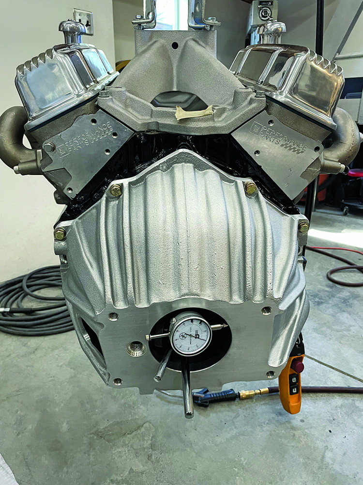 07 Complete V8 engine on hoist silver paint headers dial indicator crankshaft alignment