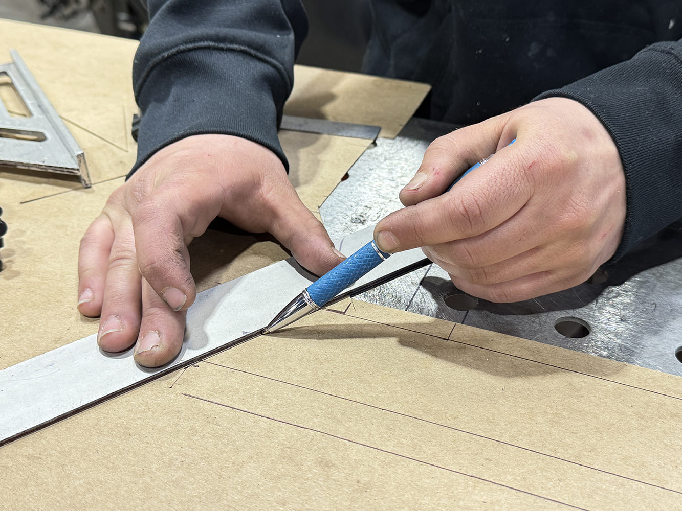 11 Marking cardboard template blue pencil metal ruler perforated steel bench