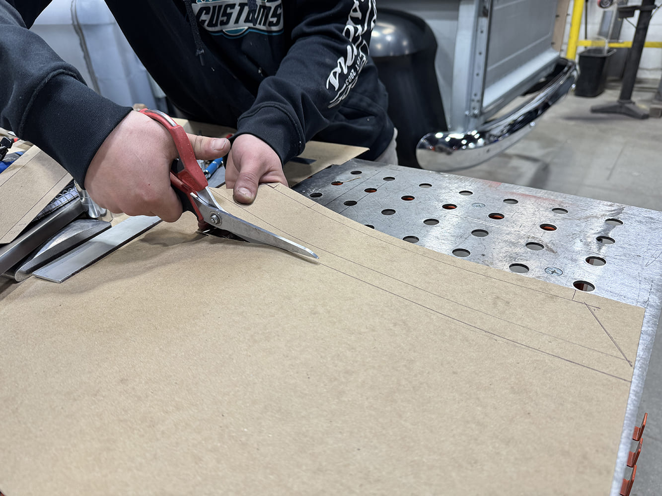 12 Cutting cardboard template red aviation snips “CUSTOMS” shirt truck bed and chrome bumper behind