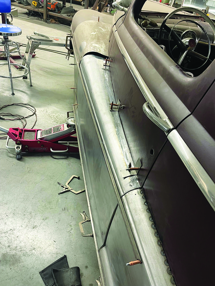 13 1947 Ford coupe close up fadeaway fender attached with cleco fasteners door open