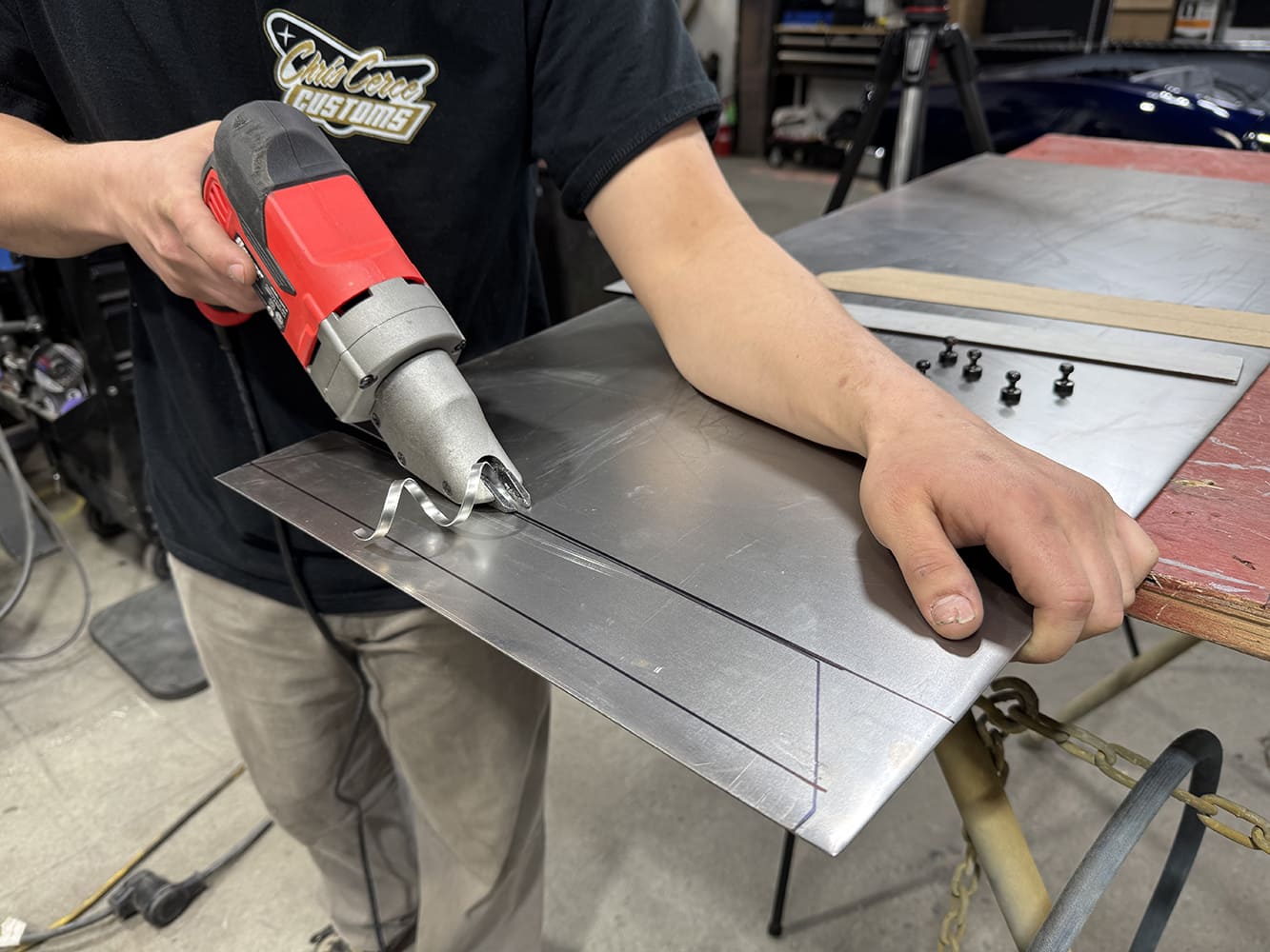 14 Cutting sheet metal large red electric shear template screws steel rule on red table