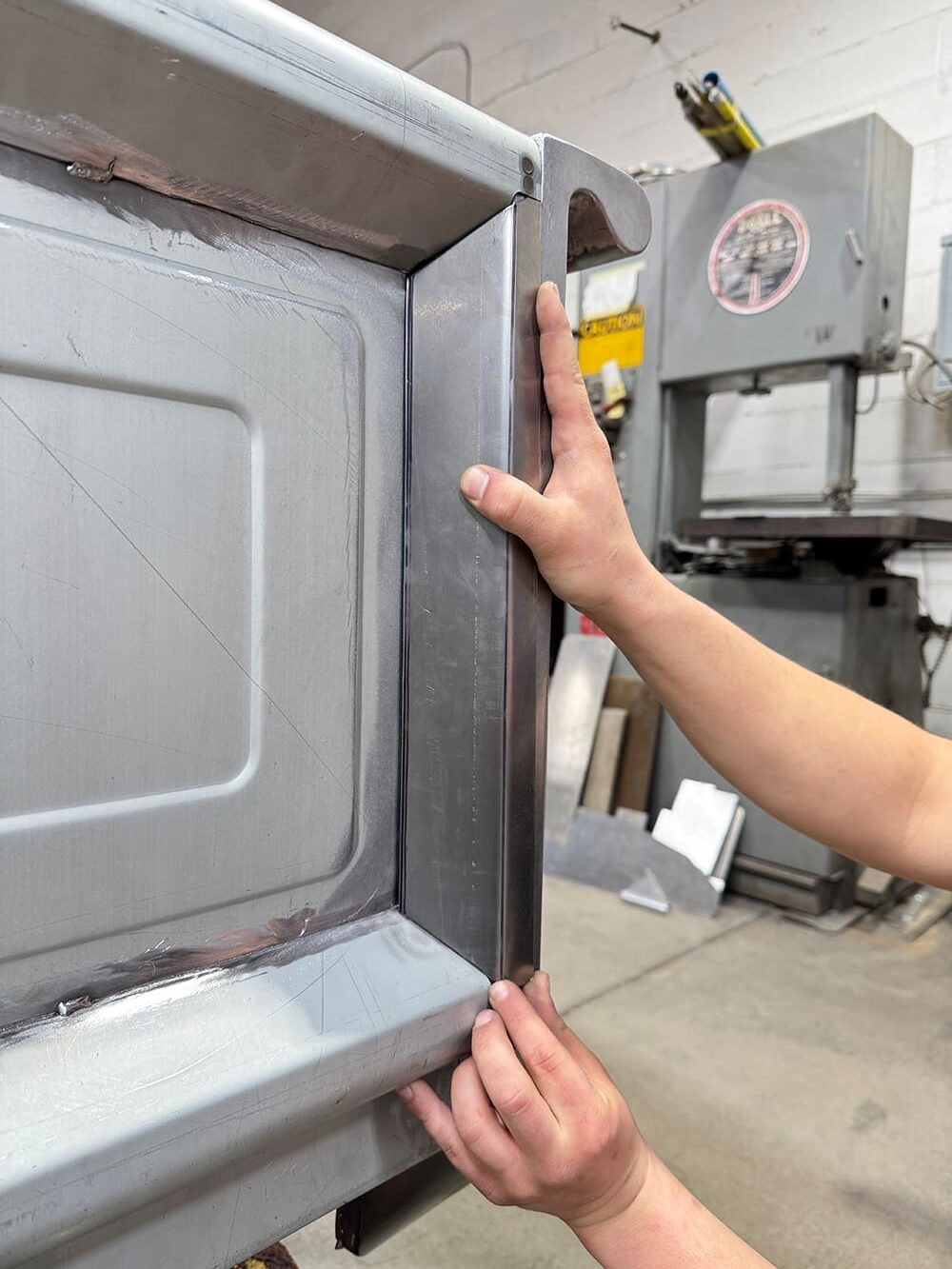 18 Test fitting inner edge panel on tailgate hand alignment clean silver metal