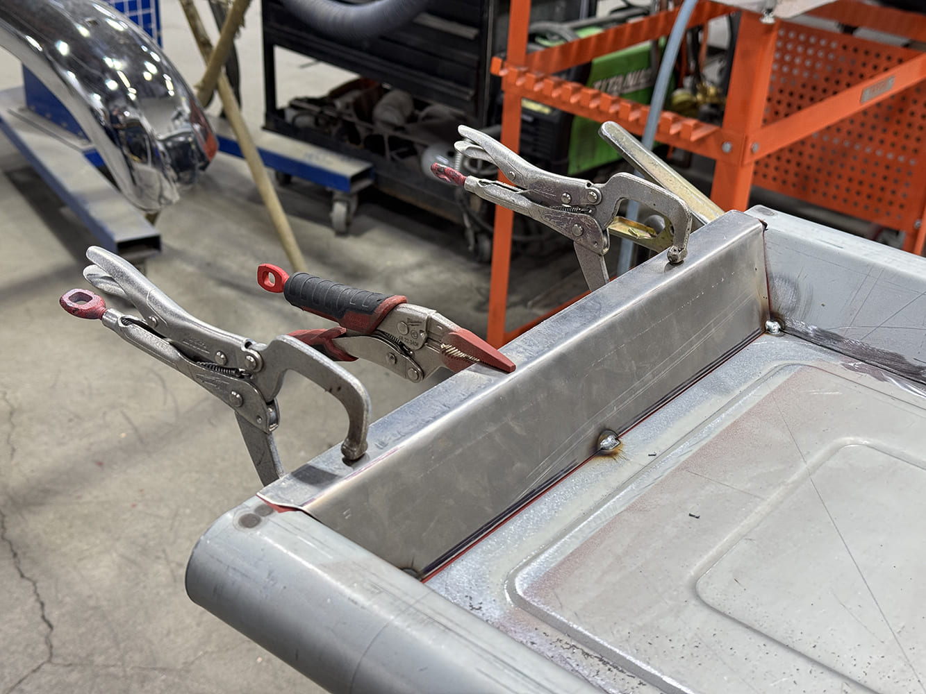 21 Tailgate edge clamped three C clamps plus snips fresh corner welds