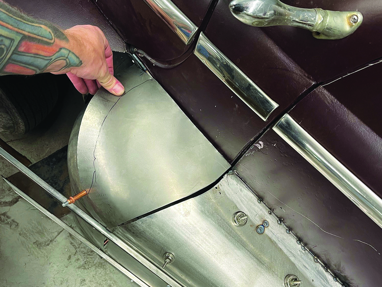 27 Hand positioning curved fadeaway fender panel on 1947 Ford coupe cleco fastener trim detail