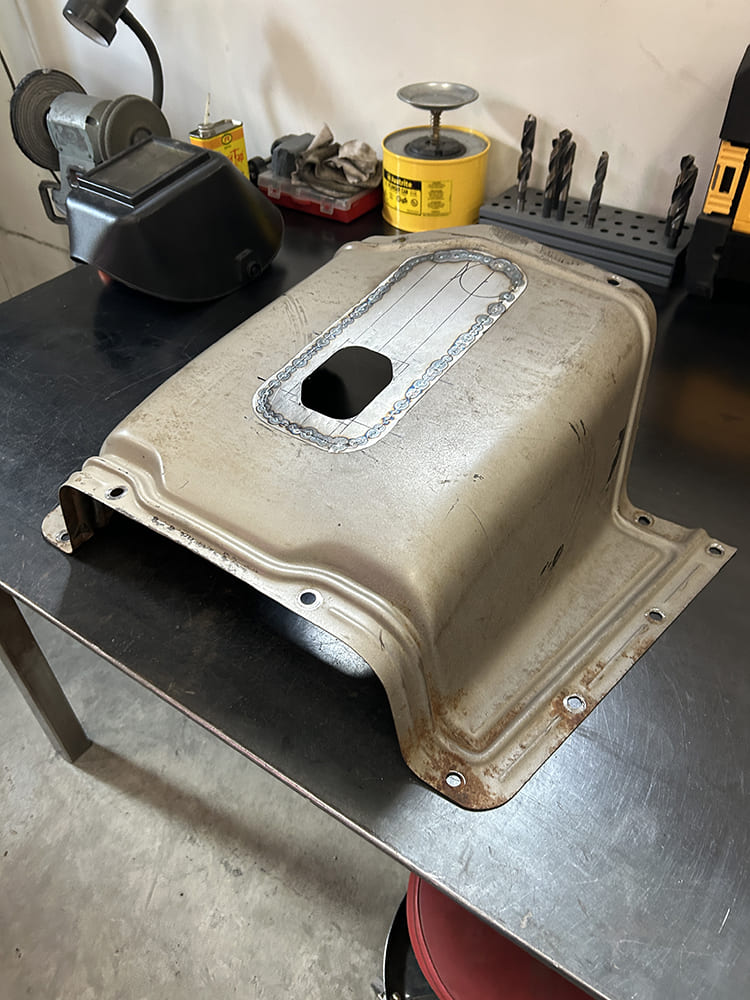 28 Welded transmission tunnel cover rectangular patch installed workbench grinding wheel Chevy parts