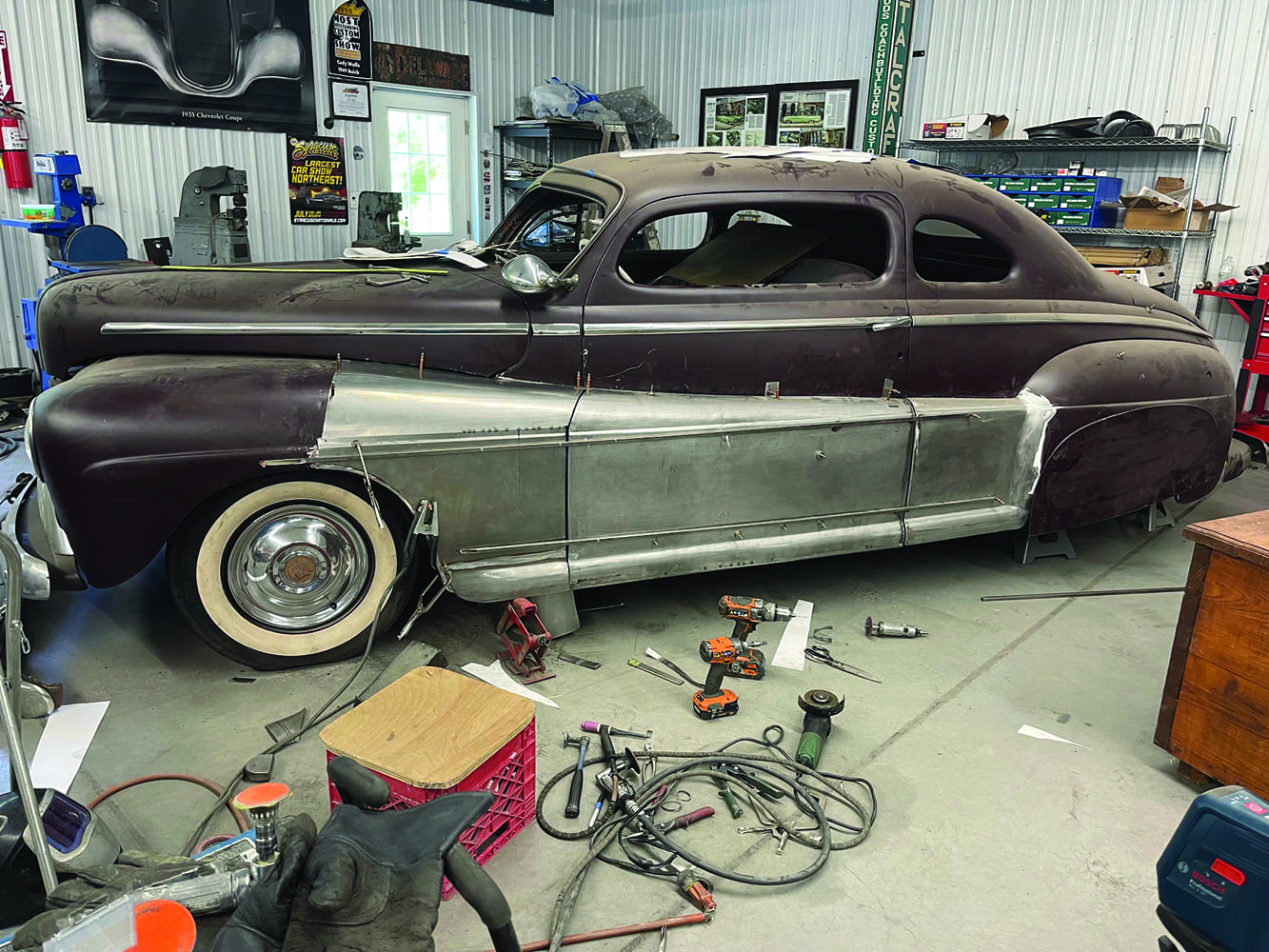 29 1947 Ford coupe full side multiple fadeaway fender panels installed shop tools scattered